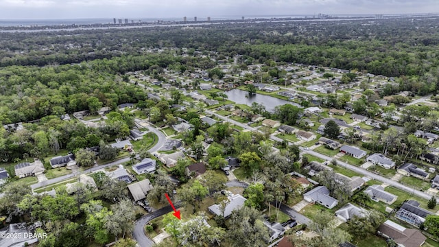 drone / aerial view with a residential view and a water view