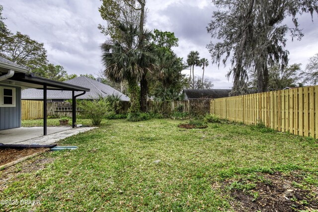 view of yard with a fenced backyard and a patio area