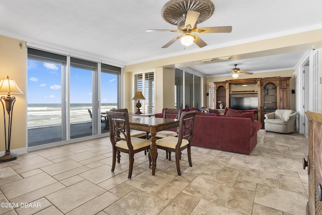 4621 S Atlantic Ave Ave Unit 7101, Ponce Inlet, FL 32127 - dining room with ceiling fan, crown molding, and a wall of windows
