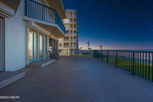 4621 S Atlantic Ave Ave Unit 7101, Ponce Inlet, FL 32127 - patio terrace at dusk with a balcony
