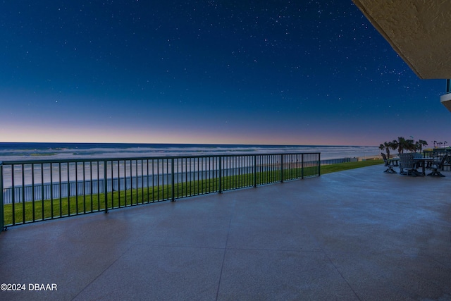 4621 S Atlantic Ave Ave Unit 7101, Ponce Inlet, FL 32127 - patio terrace at dusk with a water view