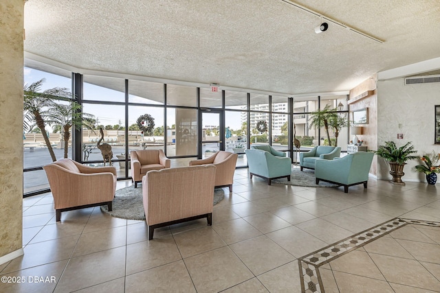 1 Oceans W Blvd Unit 8A2, Daytona Beach, FL 32118 - building lobby featuring a wall of windows and a textured ceiling