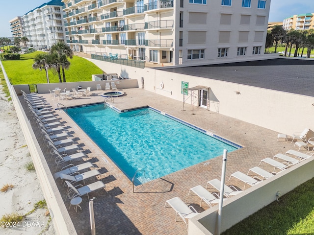 view of swimming pool with a patio