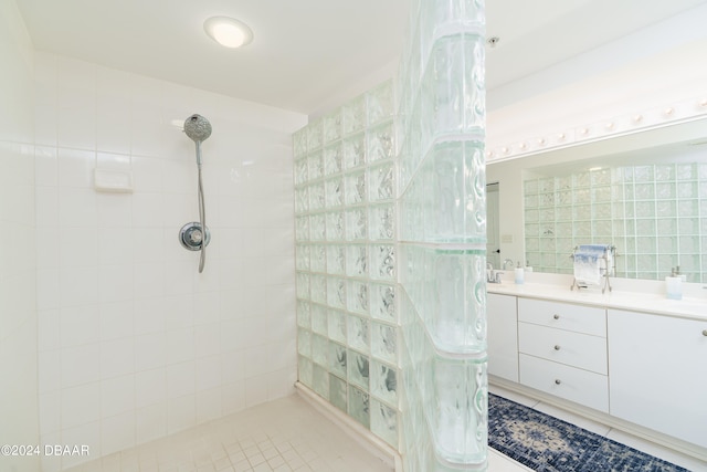 bathroom featuring tile walls, vanity, and tile patterned floors