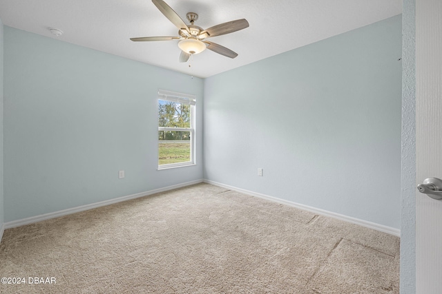 unfurnished room featuring carpet flooring and ceiling fan