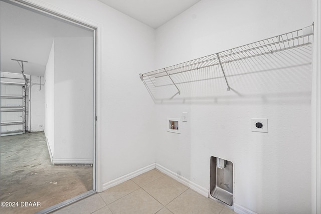 clothes washing area with electric dryer hookup and hookup for a washing machine