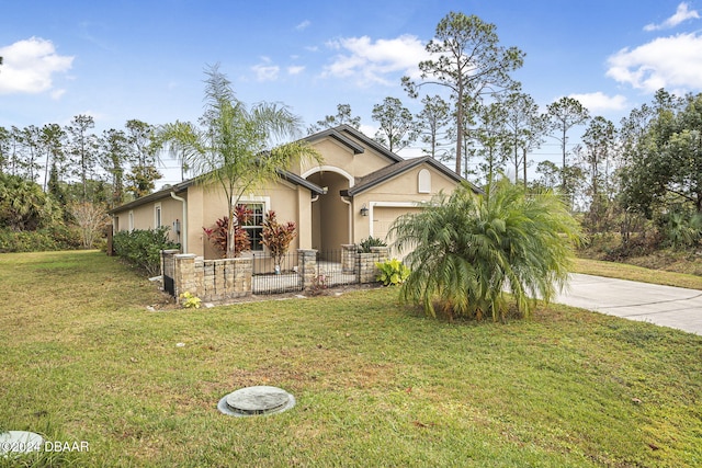 view of front of house with a garage and a front lawn