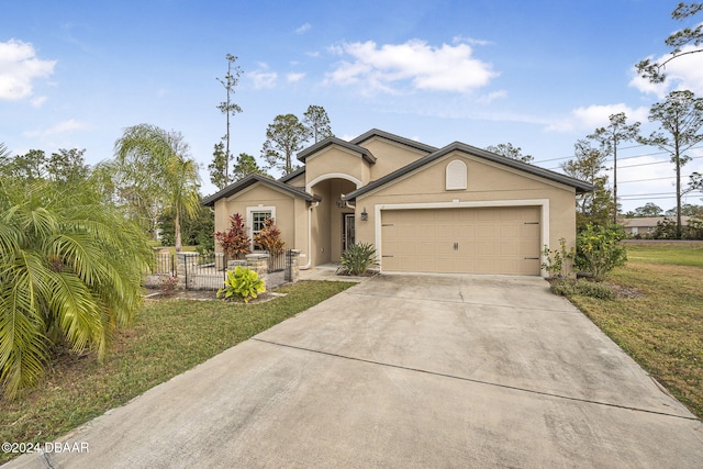 view of front facade with a front yard and a garage