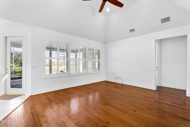 unfurnished living room with wood-type flooring, ceiling fan, and lofted ceiling