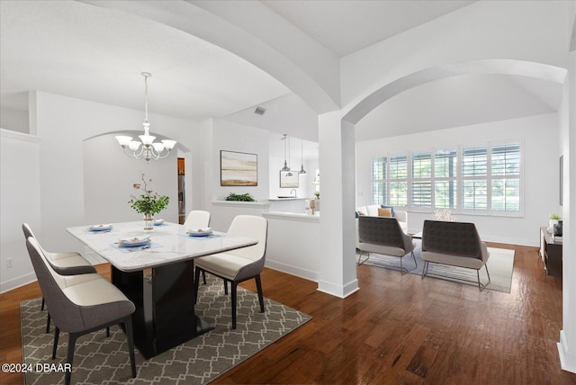 dining room featuring a notable chandelier and dark wood-type flooring