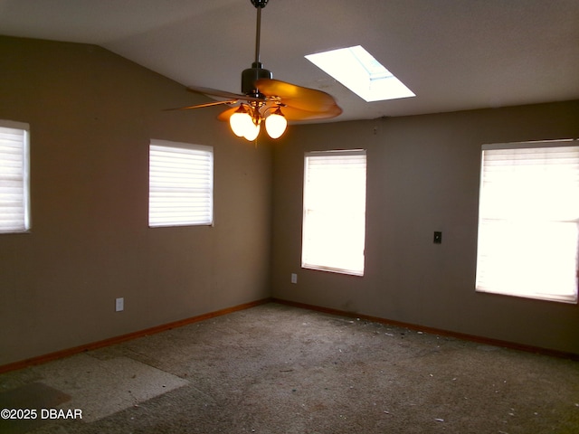 carpeted spare room featuring lofted ceiling