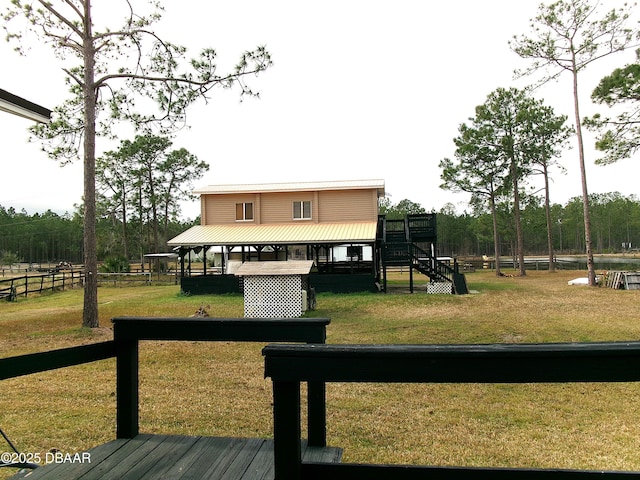 view of home's community featuring a lawn