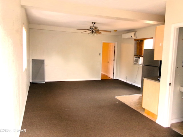 unfurnished living room with ceiling fan, a wall mounted AC, dark carpet, and cooling unit