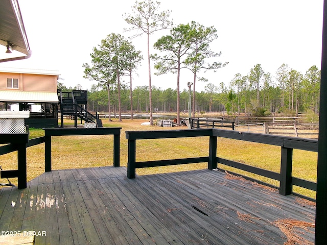 wooden terrace with a yard