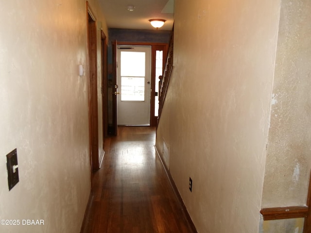 corridor with hardwood / wood-style floors