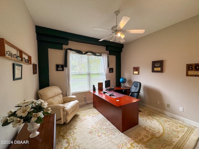 office space with ceiling fan and a textured ceiling