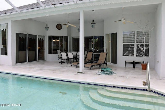 view of pool with ceiling fan and a patio area