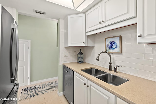 kitchen with white cabinetry, sink, and stainless steel appliances