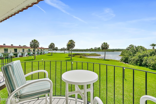 balcony featuring a water view