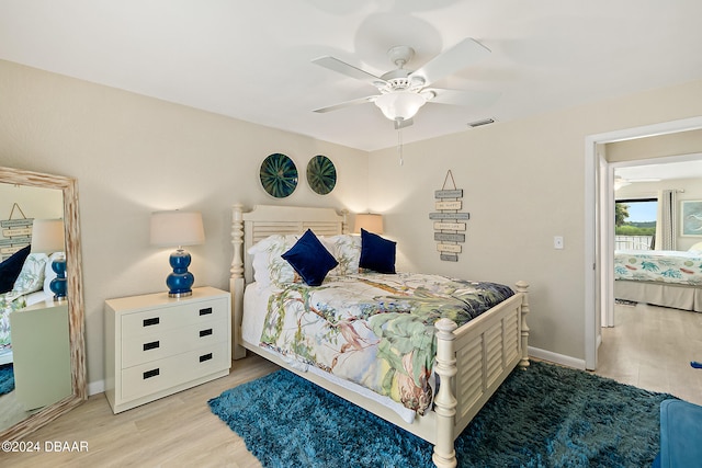 bedroom featuring light hardwood / wood-style flooring and ceiling fan