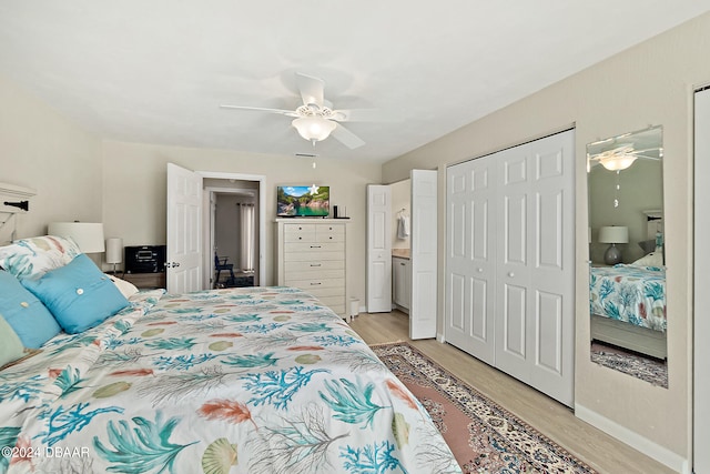 bedroom with ceiling fan, a closet, and light wood-type flooring