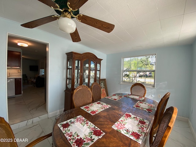 dining space featuring ceiling fan