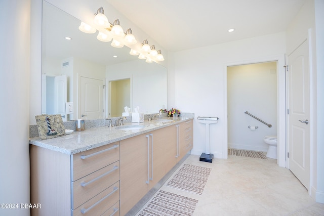 bathroom with toilet and vanity