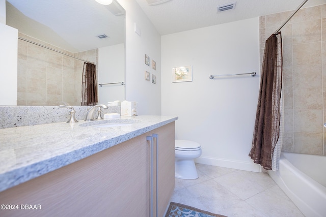 full bathroom featuring toilet, tile patterned flooring, a textured ceiling, vanity, and shower / bathtub combination with curtain