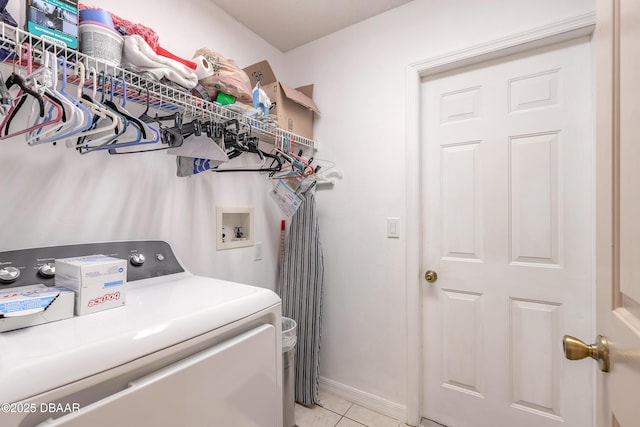 1692 Old Tomoka Rd Unit W, Ormond Beach, FL 32174 - laundry area featuring hookup for a washing machine, light tile patterned floors, and baseboards