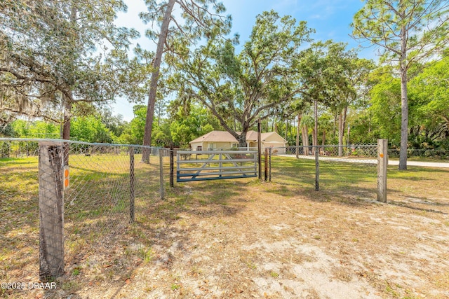 1692 Old Tomoka Rd Unit W, Ormond Beach, FL 32174 - view of yard with a gate and view of scattered trees