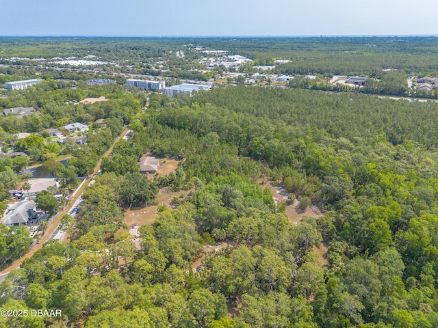 1692 Old Tomoka Rd Unit W, Ormond Beach, FL 32174 - aerial view of property and surrounding area with a heavily wooded area