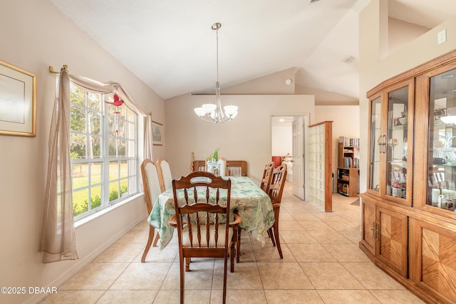 1692 Old Tomoka Rd Unit W, Ormond Beach, FL 32174 - dining area featuring a chandelier, vaulted ceiling, healthy amount of natural light, and light tile patterned floors