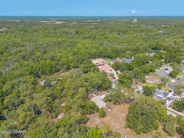 1692 Old Tomoka Rd Unit W, Ormond Beach, FL 32174 - aerial overview of property's location with a forest and nearby suburban area
