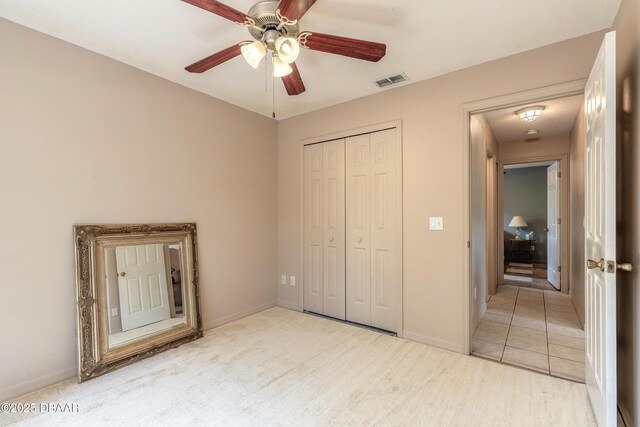 1692 Old Tomoka Rd Unit W, Ormond Beach, FL 32174 - unfurnished bedroom with a closet, baseboards, and ceiling fan