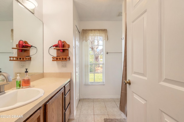 1692 Old Tomoka Rd Unit W, Ormond Beach, FL 32174 - bathroom featuring tile patterned flooring, vanity, and baseboards