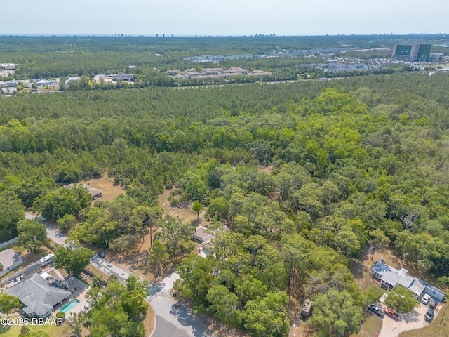 1692 Old Tomoka Rd Unit W, Ormond Beach, FL 32174 - aerial view of property and surrounding area with a heavily wooded area