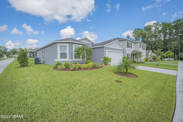 view of front facade featuring a garage, central air condition unit, and a front lawn