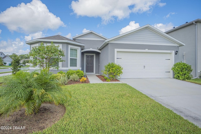 view of front facade with a garage and a front yard