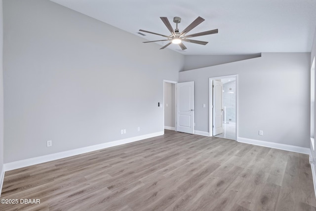 7 Traceway Ct, Ormond Beach, FL 32174 - unfurnished bedroom with lofted ceiling, light wood finished floors, ensuite bath, and ceiling fan