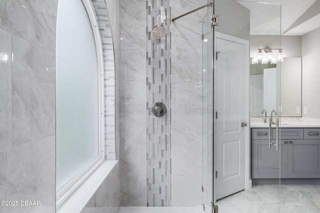 7 Traceway Ct, Ormond Beach, FL 32174 - bathroom featuring a marble finish shower, vanity, and marble finish flooring
