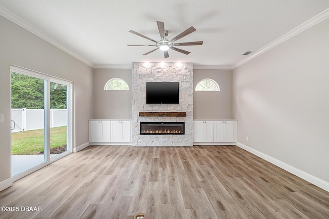 7 Traceway Ct, Ormond Beach, FL 32174 - unfurnished living room featuring a ceiling fan, ornamental molding, wood finished floors, and a fireplace