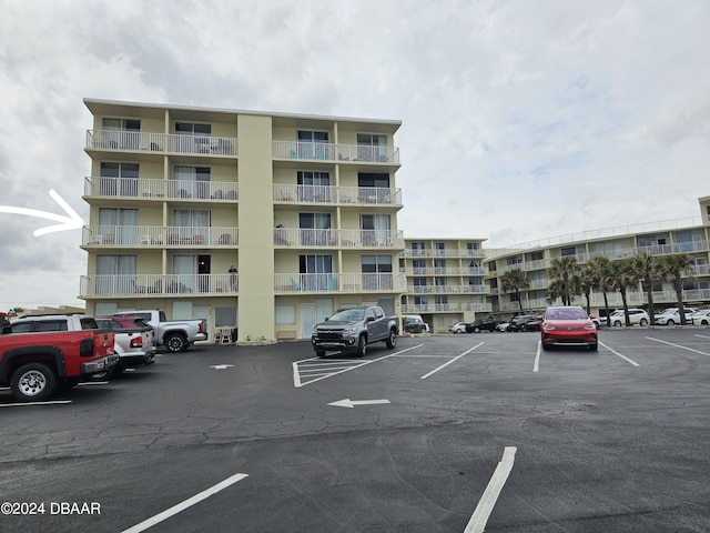 1233 S Atlantic Ave Unit 3310, Daytona Beach, FL 32118 - view of apartment building / complex with uncovered parking