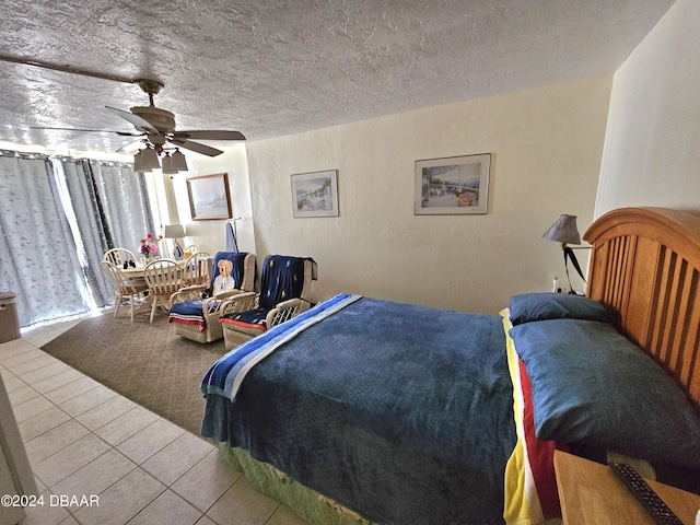 1233 S Atlantic Ave Unit 3310, Daytona Beach, FL 32118 - bedroom with tile patterned flooring, a ceiling fan, and a textured ceiling