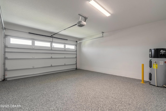 garage featuring a garage door opener and hybrid water heater