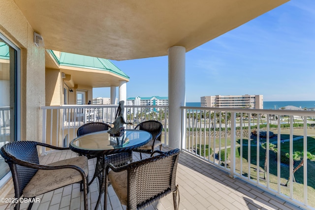 balcony featuring a water view