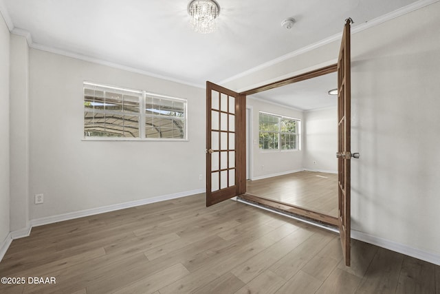 656 Winchester St, Daytona Beach, FL 32114 - empty room featuring crown molding, french doors, and wood finished floors