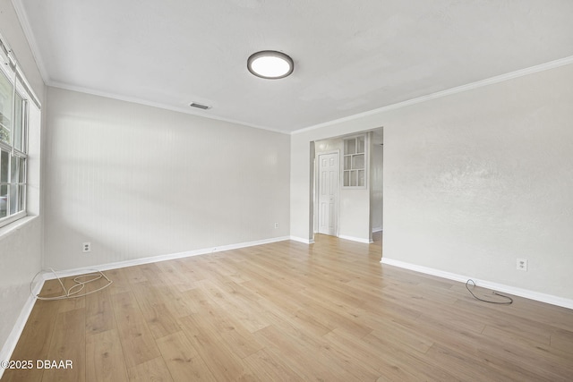 656 Winchester St, Daytona Beach, FL 32114 - unfurnished room with visible vents, baseboards, crown molding, and light wood-type flooring