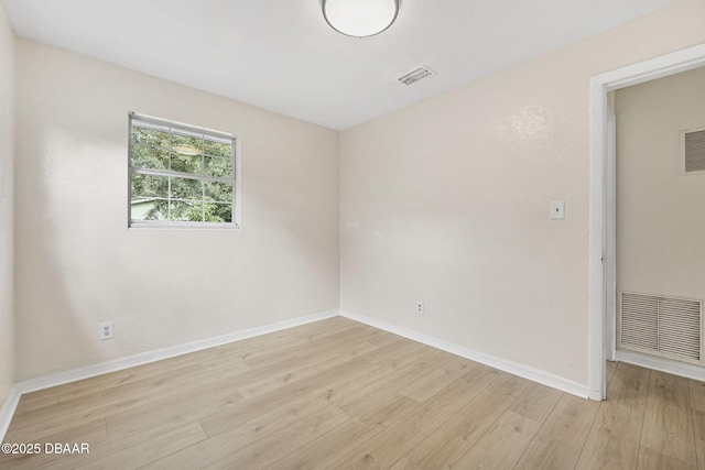 656 Winchester St, Daytona Beach, FL 32114 - empty room featuring light wood-style floors, baseboards, and visible vents