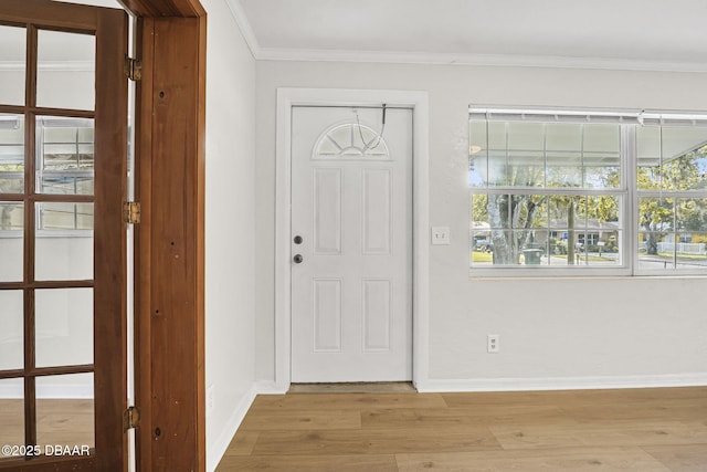 656 Winchester St, Daytona Beach, FL 32114 - entrance foyer with crown molding, baseboards, and light wood-style flooring