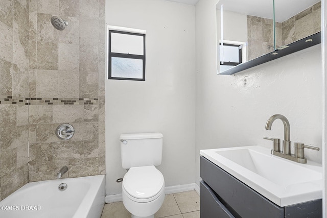 656 Winchester St, Daytona Beach, FL 32114 - bathroom with washtub / shower combination, tile patterned flooring, vanity, toilet, and baseboards